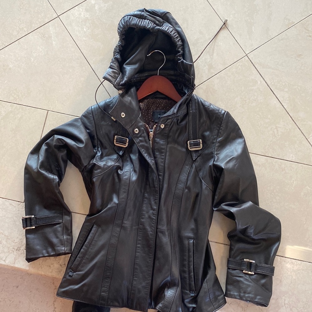 Leather jacket with a removal hood pockets and details great condition